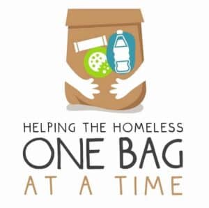 Illustration of a paper bag with food, water, and toiletries, with text: "Helping the Homeless One Bag at a Time.