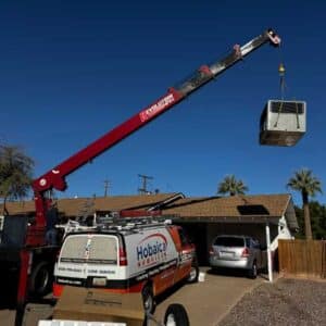Crane Lifting Air Conditioner On House In Phoenix