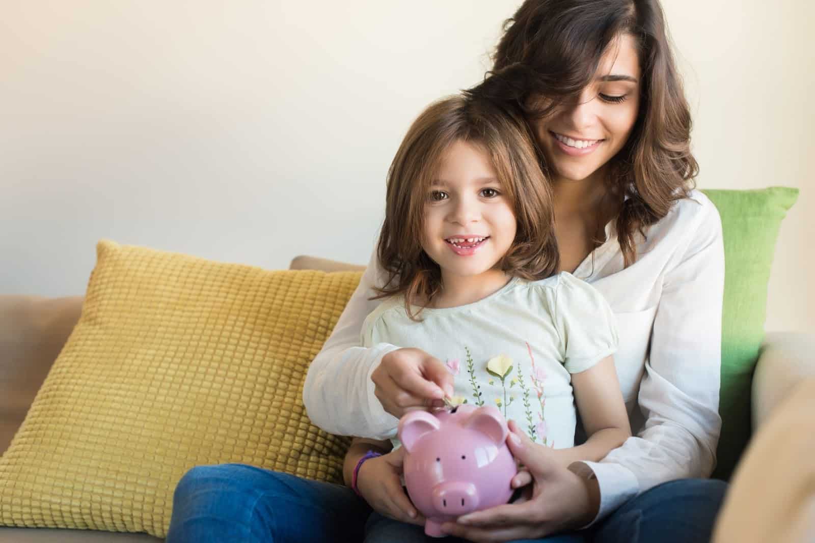 Mom And Daughter Saving Money